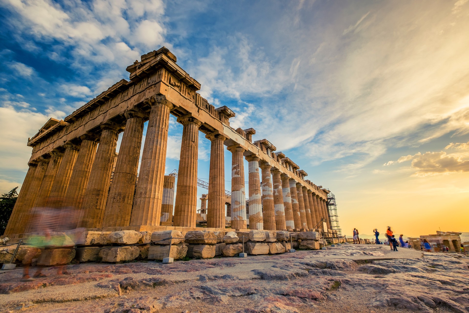 Low angle perspective of columns of the Parthenon at sunset, Acropolis, Athens