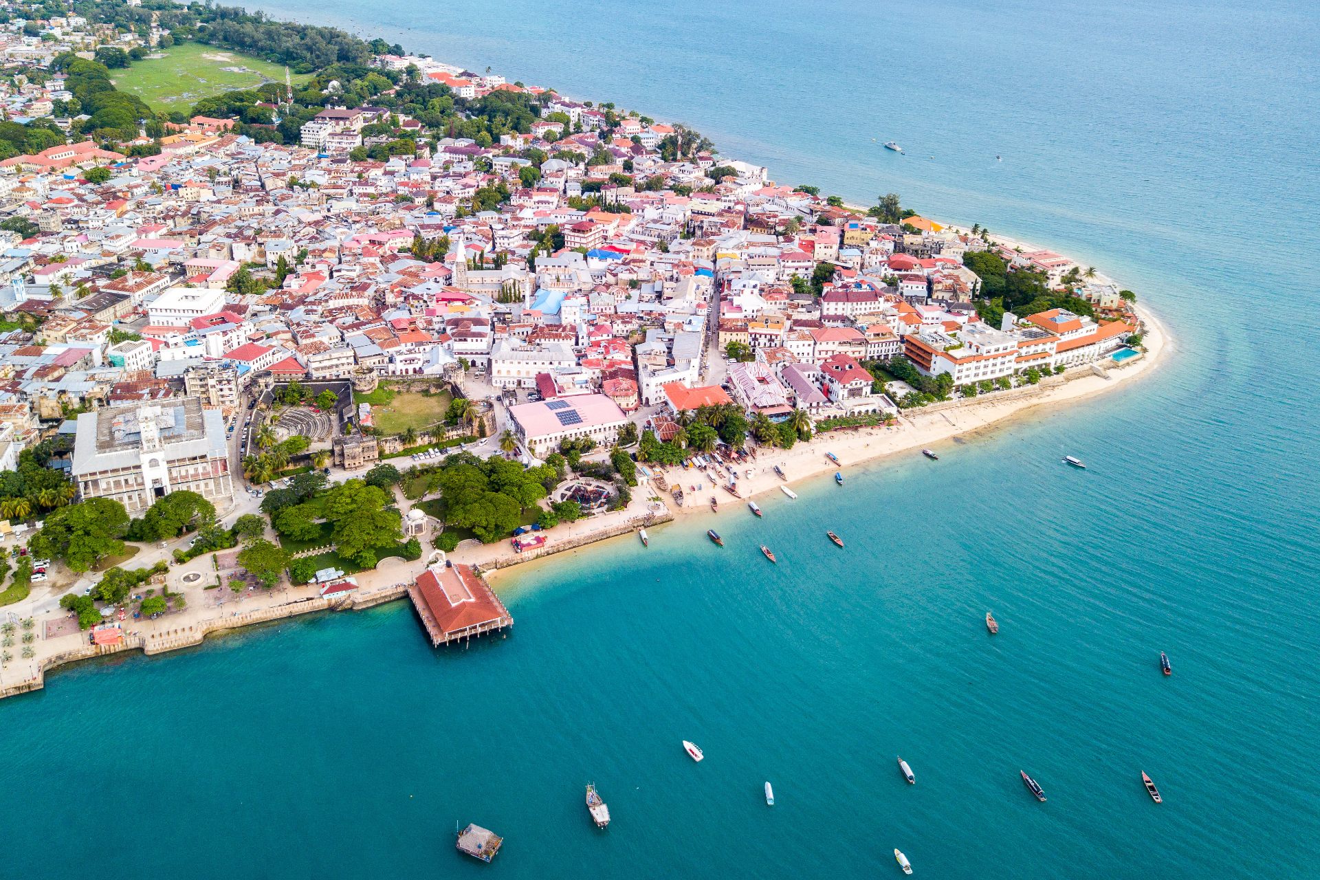 An aerial view of azure sea and stunning yellow beaches on Unguja island, Tanzania.